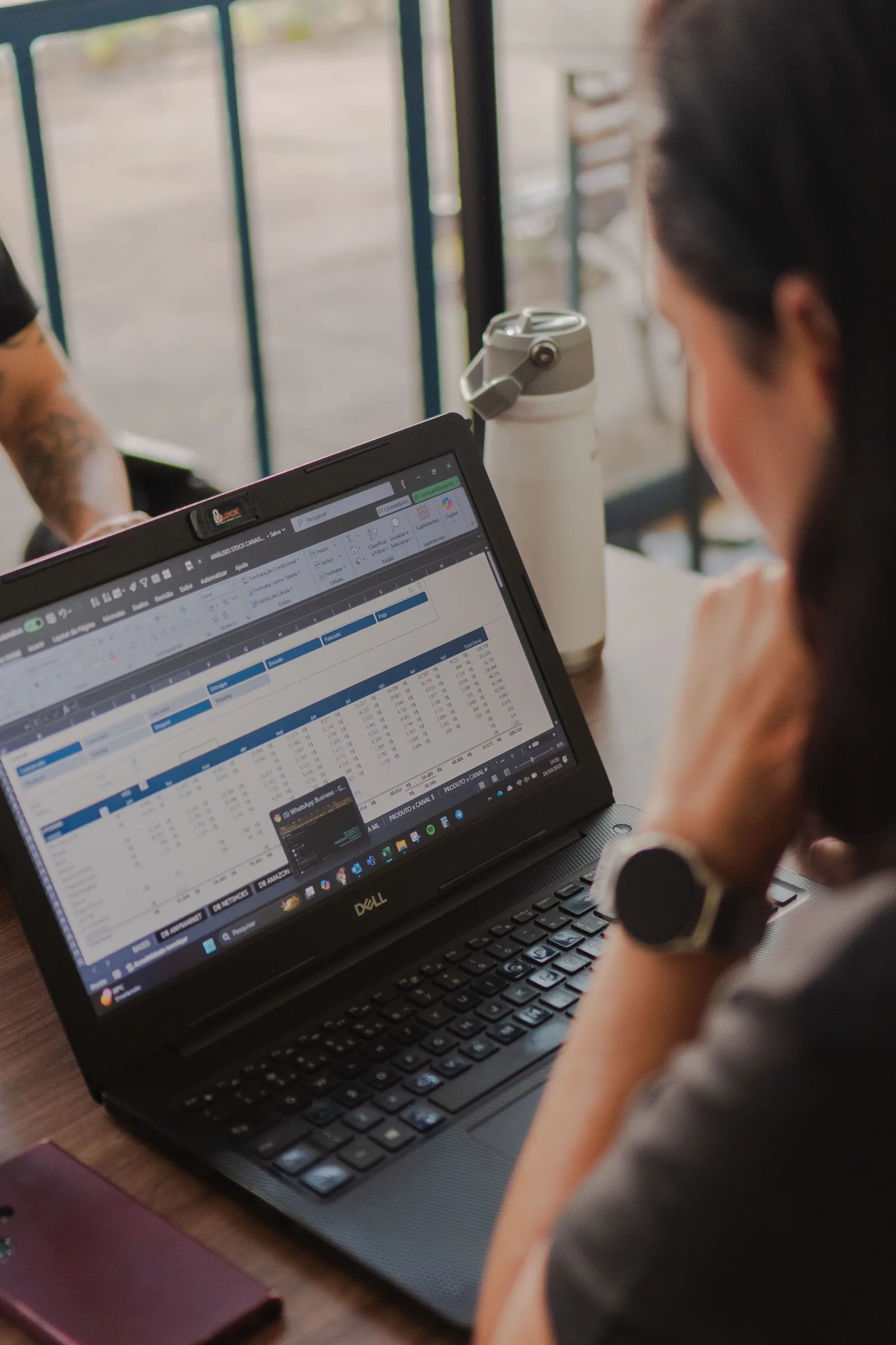 Close-up of a person reviewing performance data on a laptop