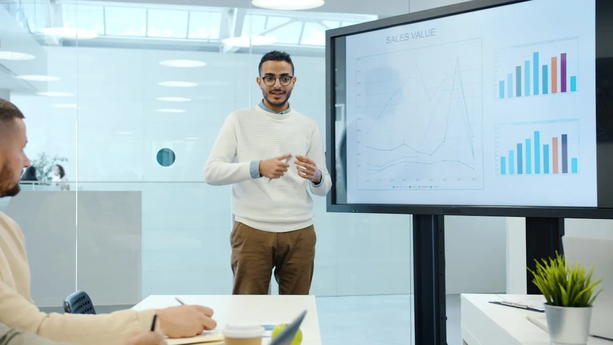 Team reviewing consolidated business charts together in a meeting, representing unified decision-making